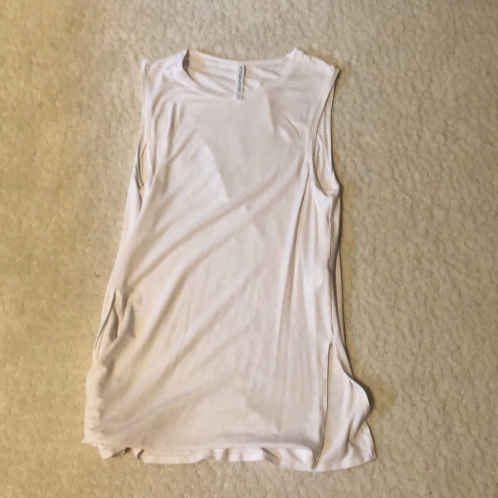 White Fabletics athletic tank top in size medium.